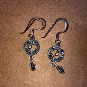 Silver dangle earrings.